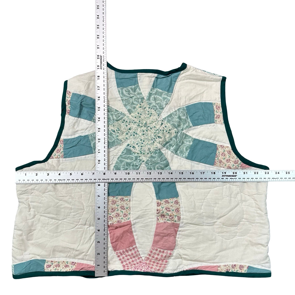 Teal & Rose Wedding Ring XL quilted vest rework, tape measure across the chest