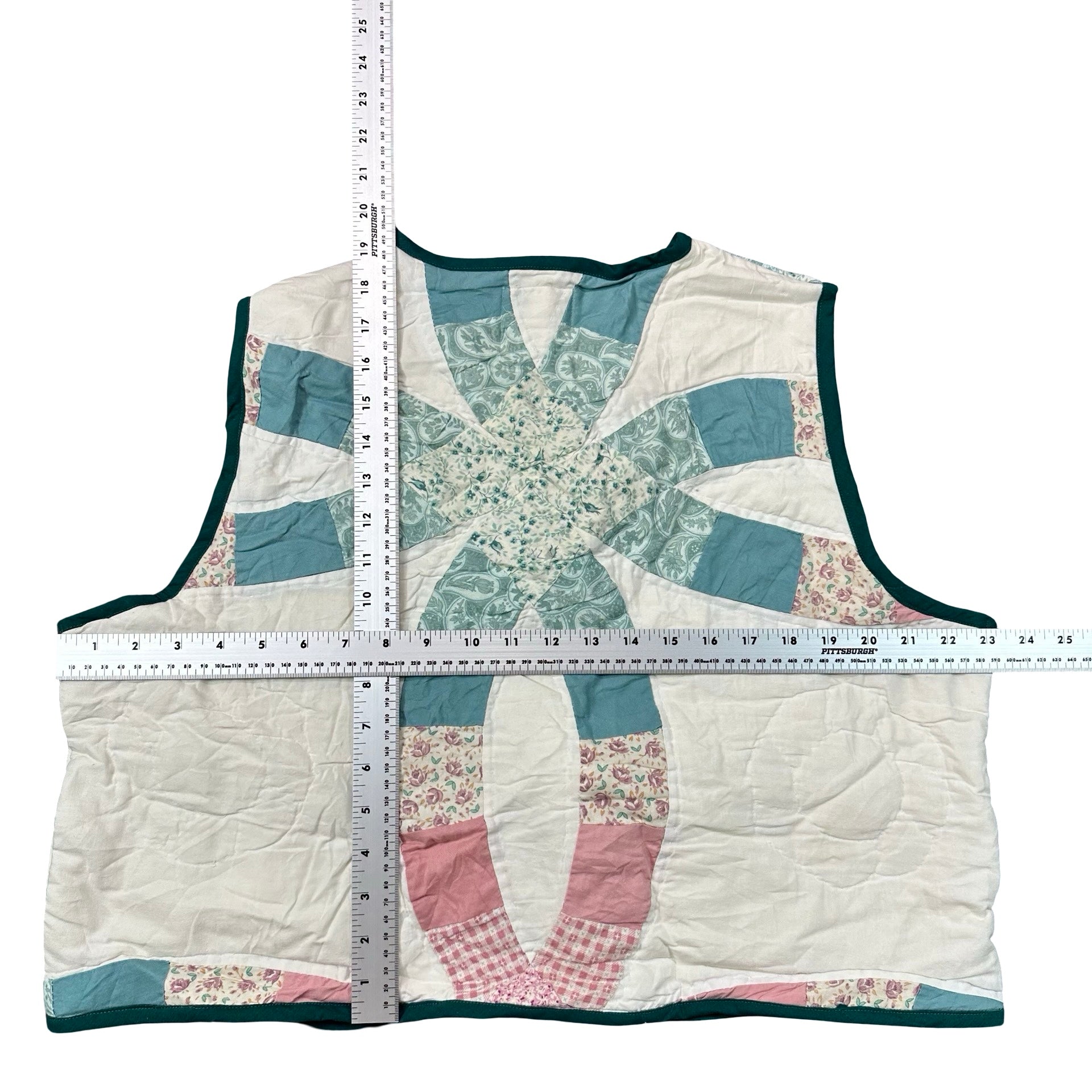Teal & Rose Wedding Ring XL quilted vest rework, tape measure across the chest
