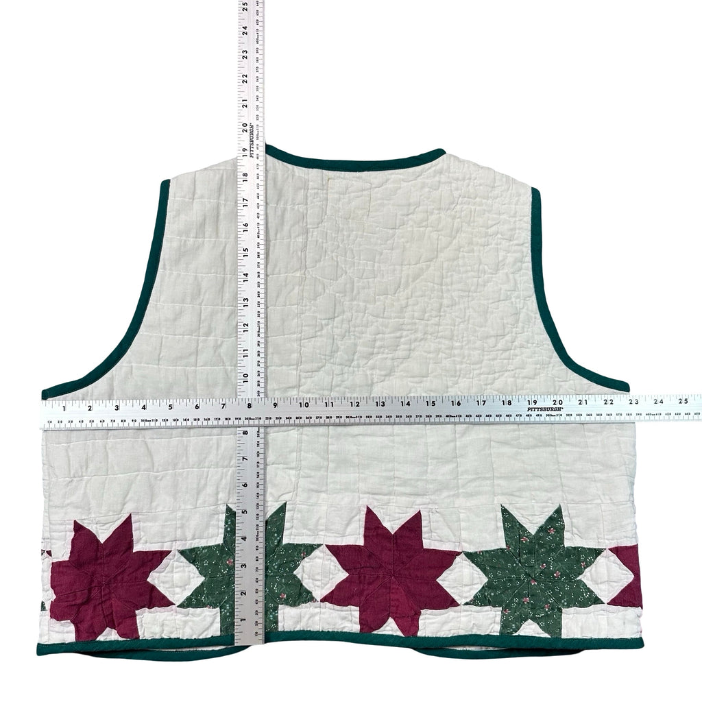 Cranberry & Pine Star XL quilted vest rework, tape measure across the chest