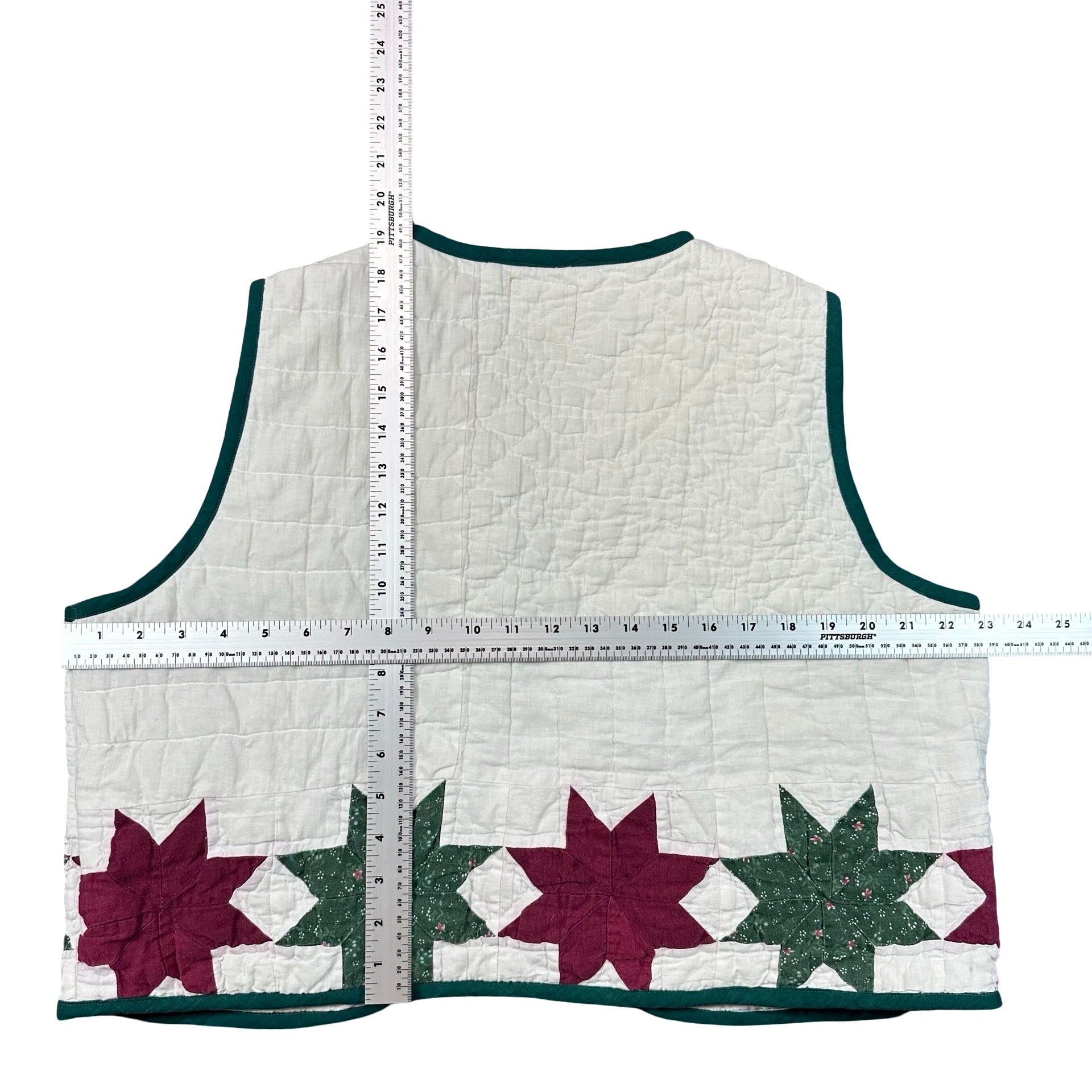 Cranberry & Pine Star XL quilted vest rework, tape measure across the chest