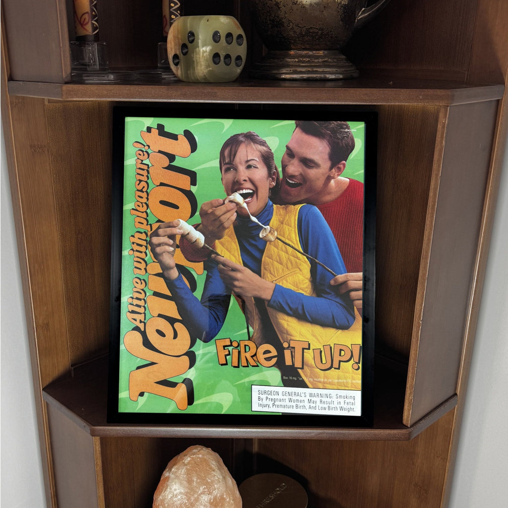 Newport framed print displayed on a wooden shelf