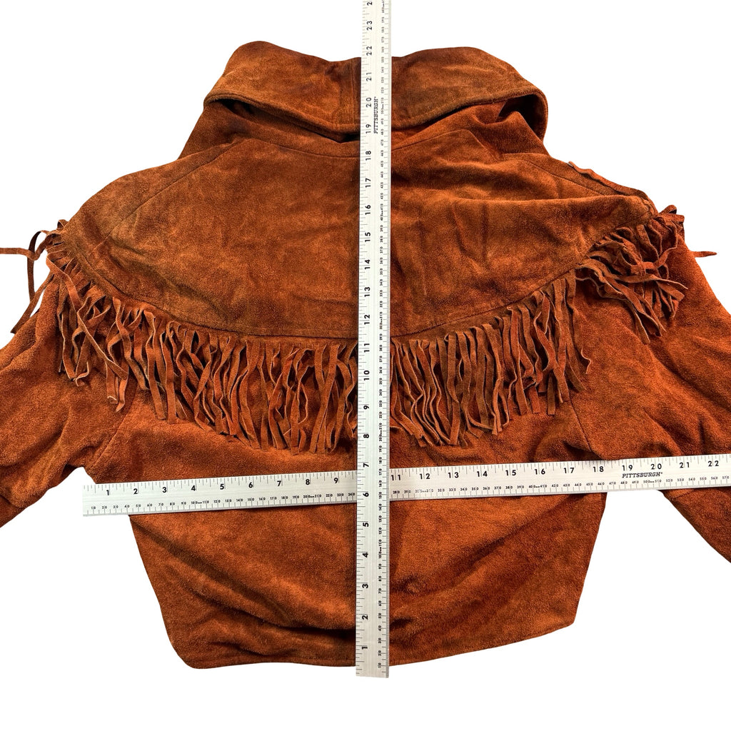 Rust suede fringe jacket laid flat with measuring tape
