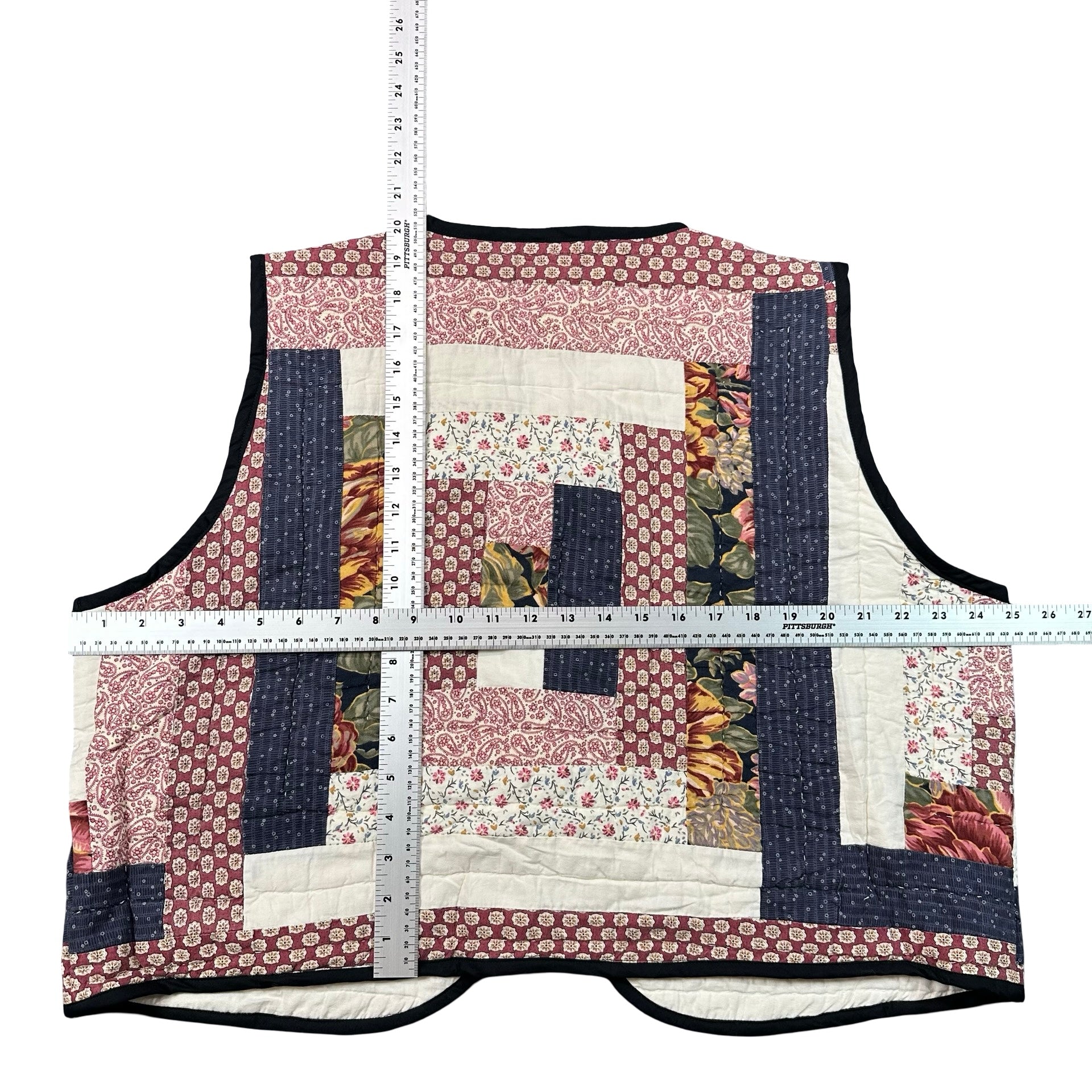 Claret Courthouse Steps quilted vest rework, flat lay measurements with tape measure