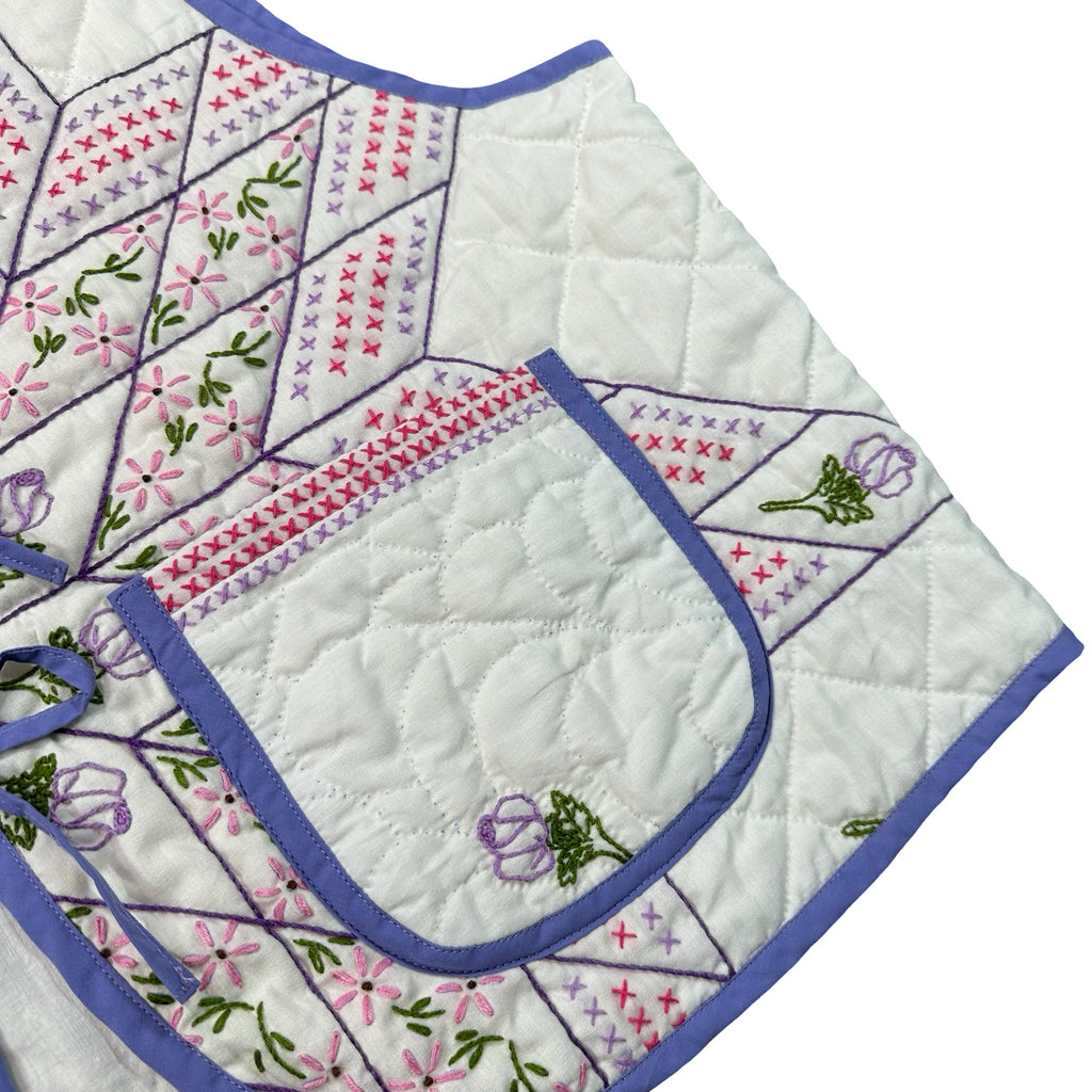 Periwinkle Cross Stitch Star quilted vest rework, front pocket and embroidery detail