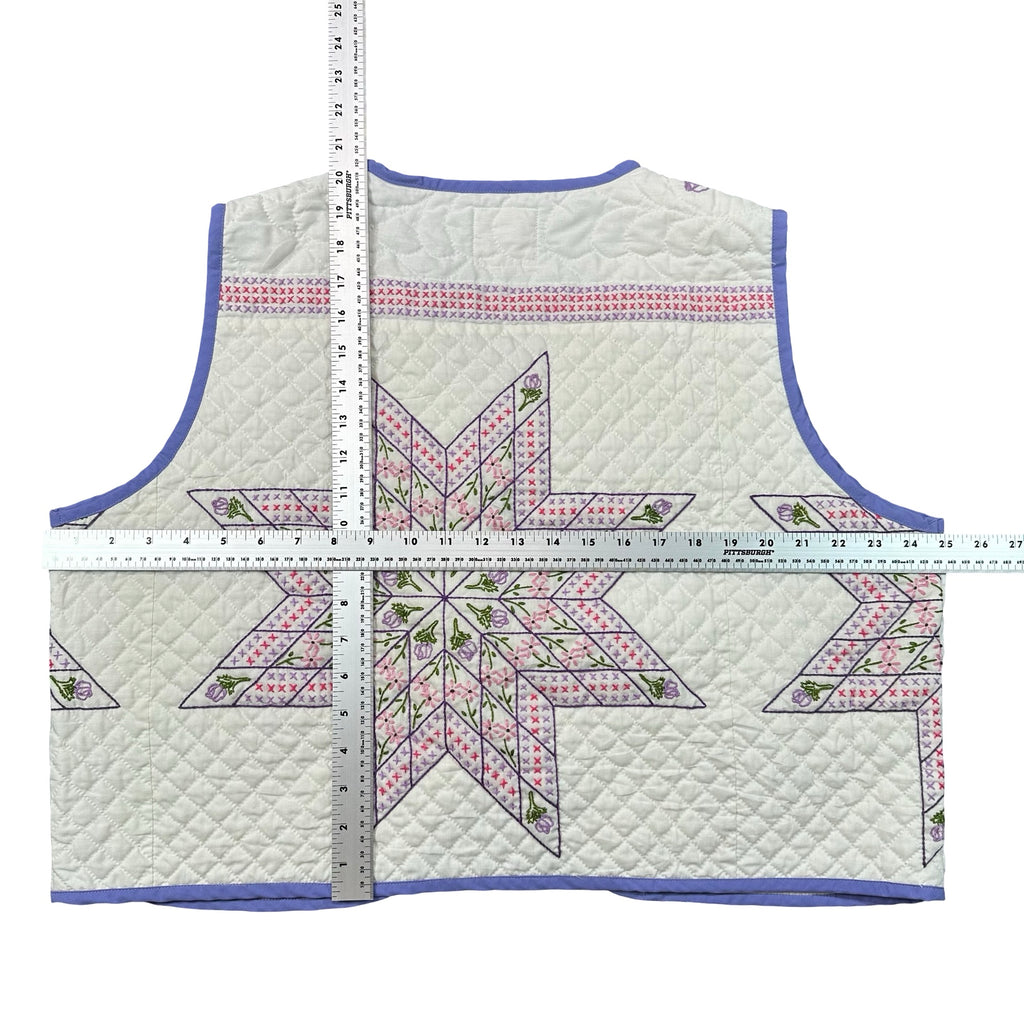 Periwinkle Cross Stitch Star quilted vest rework, flat lay measurements with tape measure