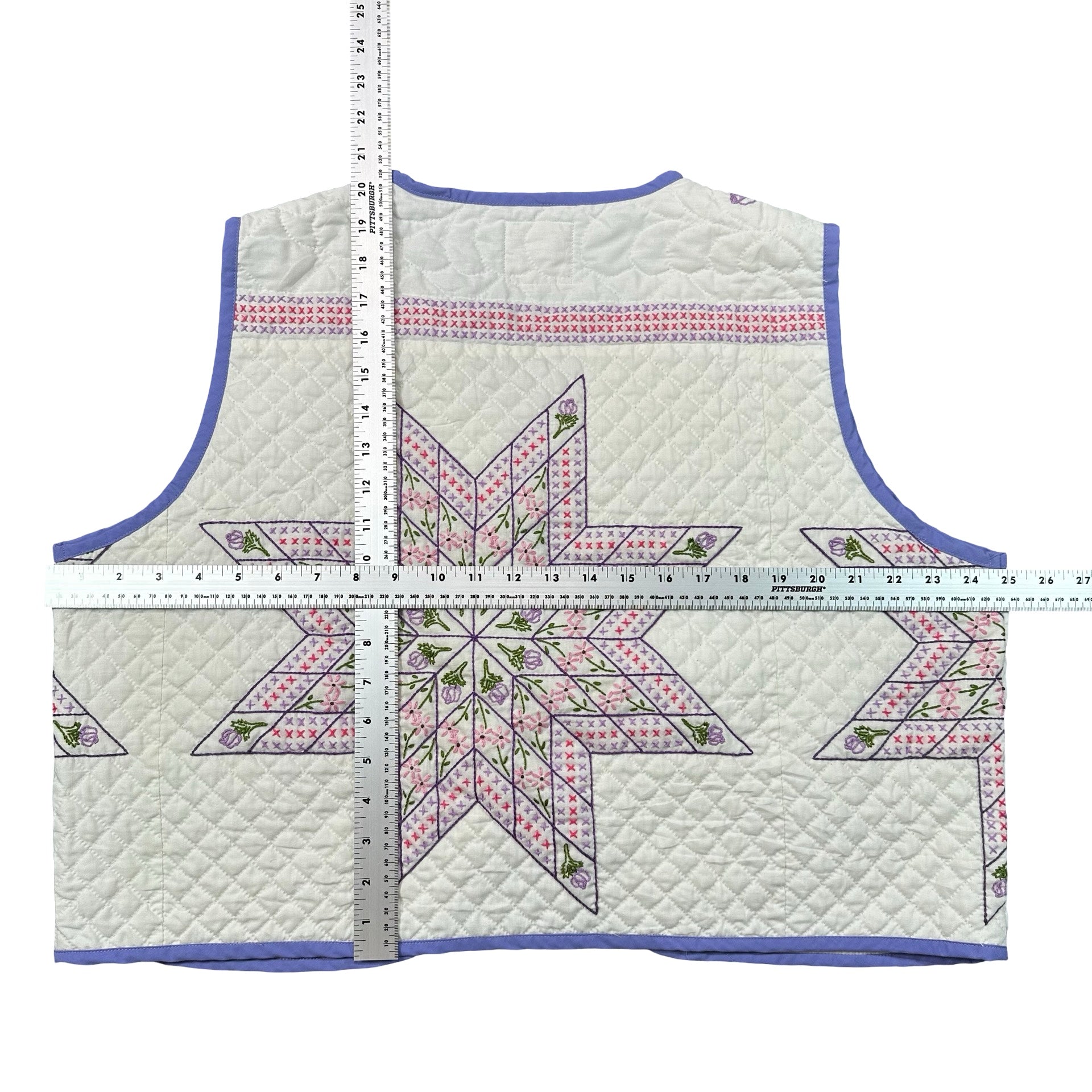 Periwinkle Cross Stitch Star quilted vest rework, flat lay measurements with tape measure