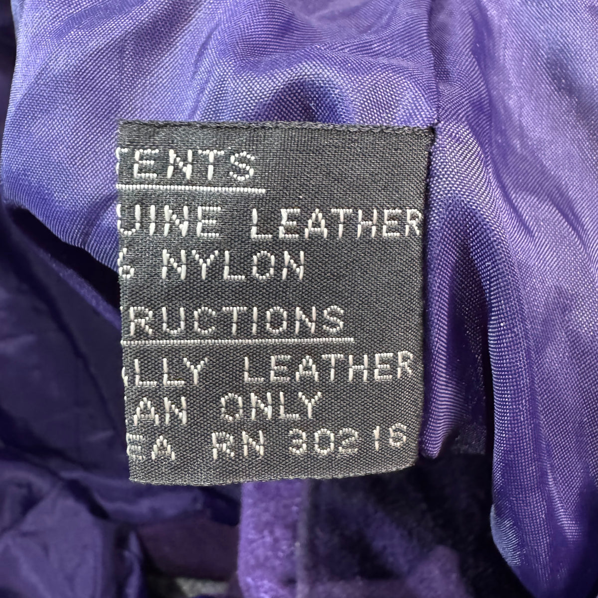 Content tag showing genuine leather shell and nylon lining, RN 30216
