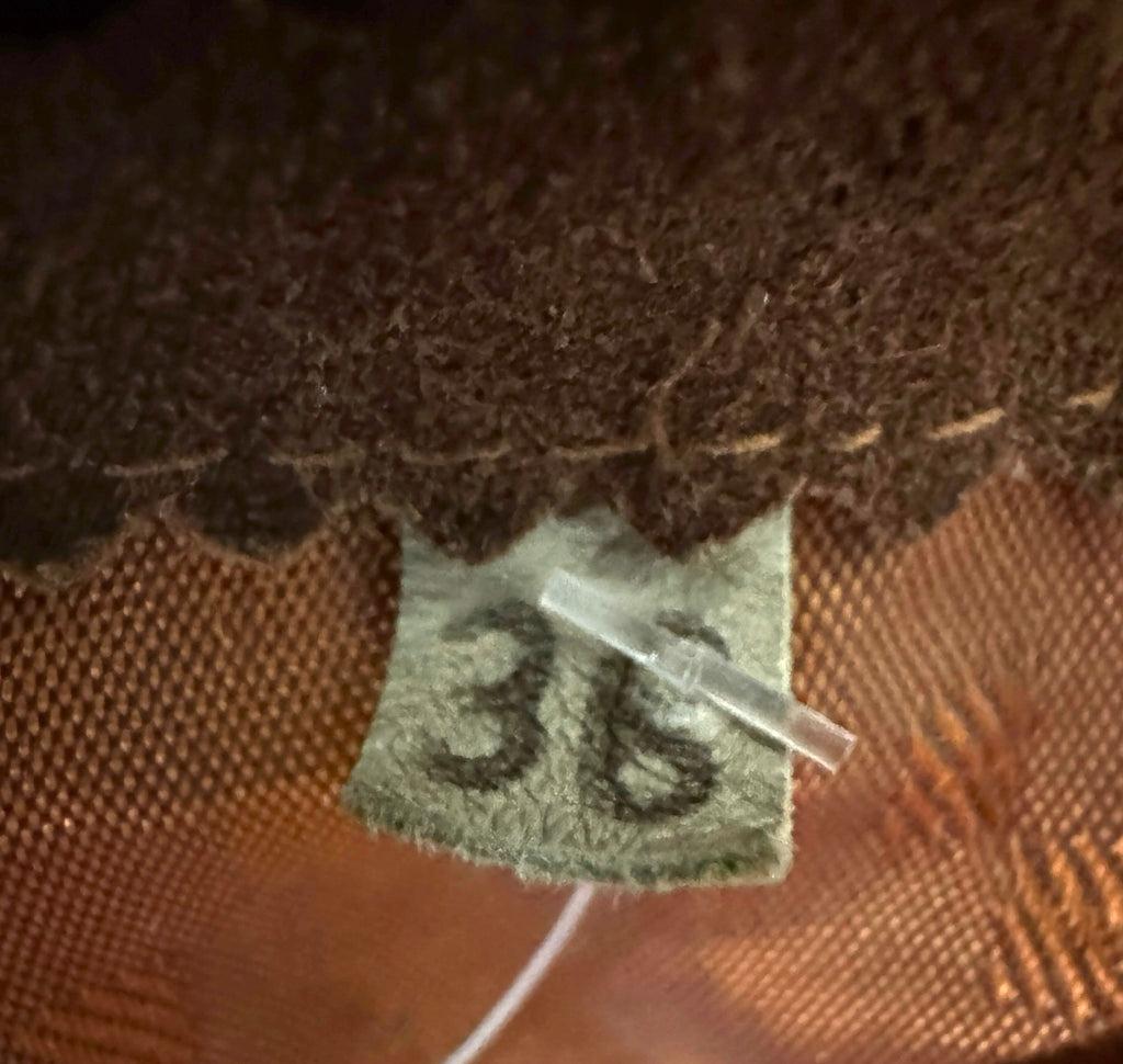 Handwritten size 36 tag inside brown suede fringe jacket