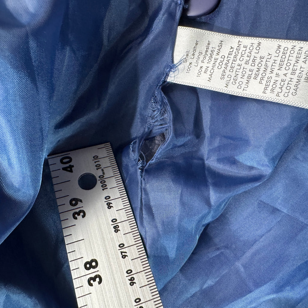 Care label inside slate blue suede jacket