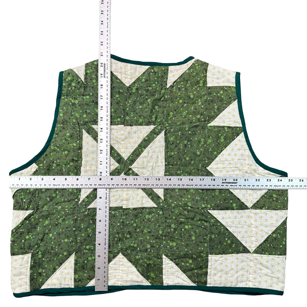 Clover Churn Dash quilted vest rework, flat lay measurements with tape measure