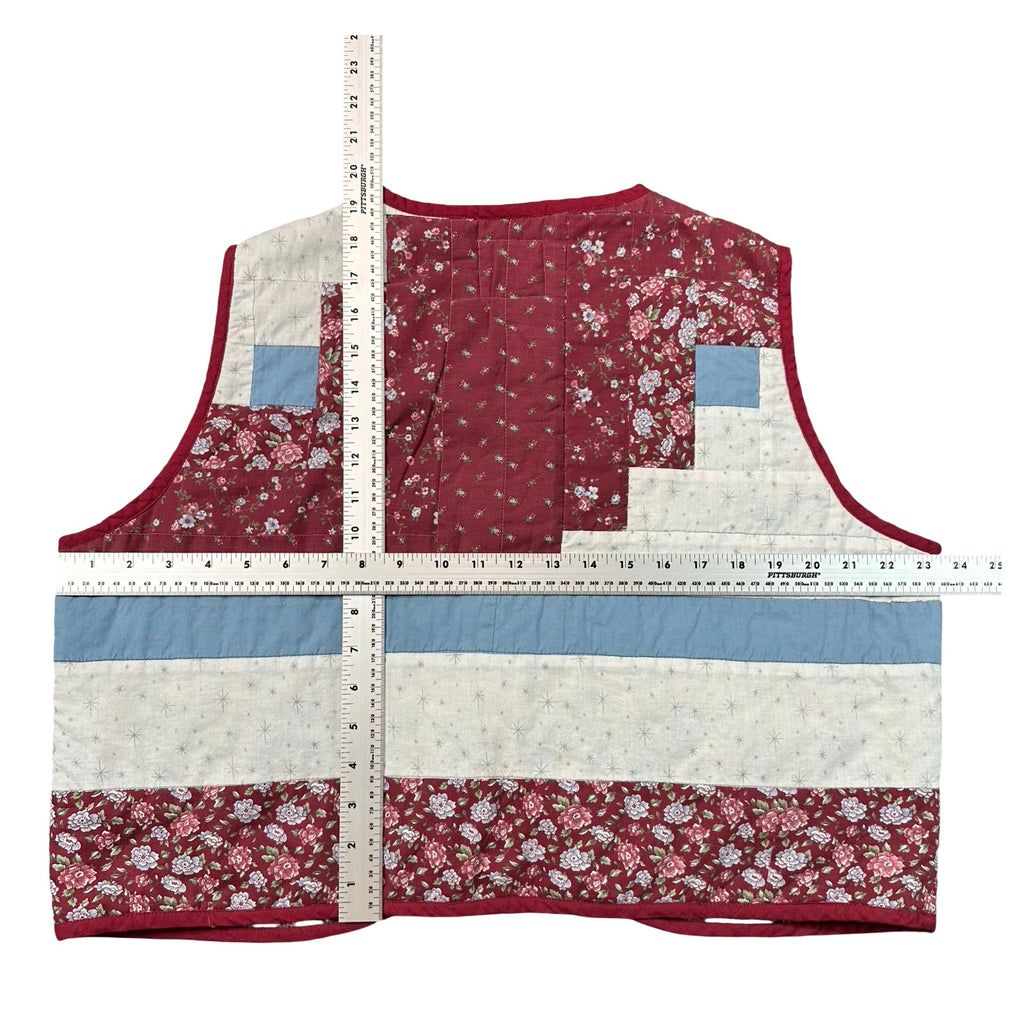 Burgundy Rose Log Cabin XL quilted vest rework, tape measure across the chest