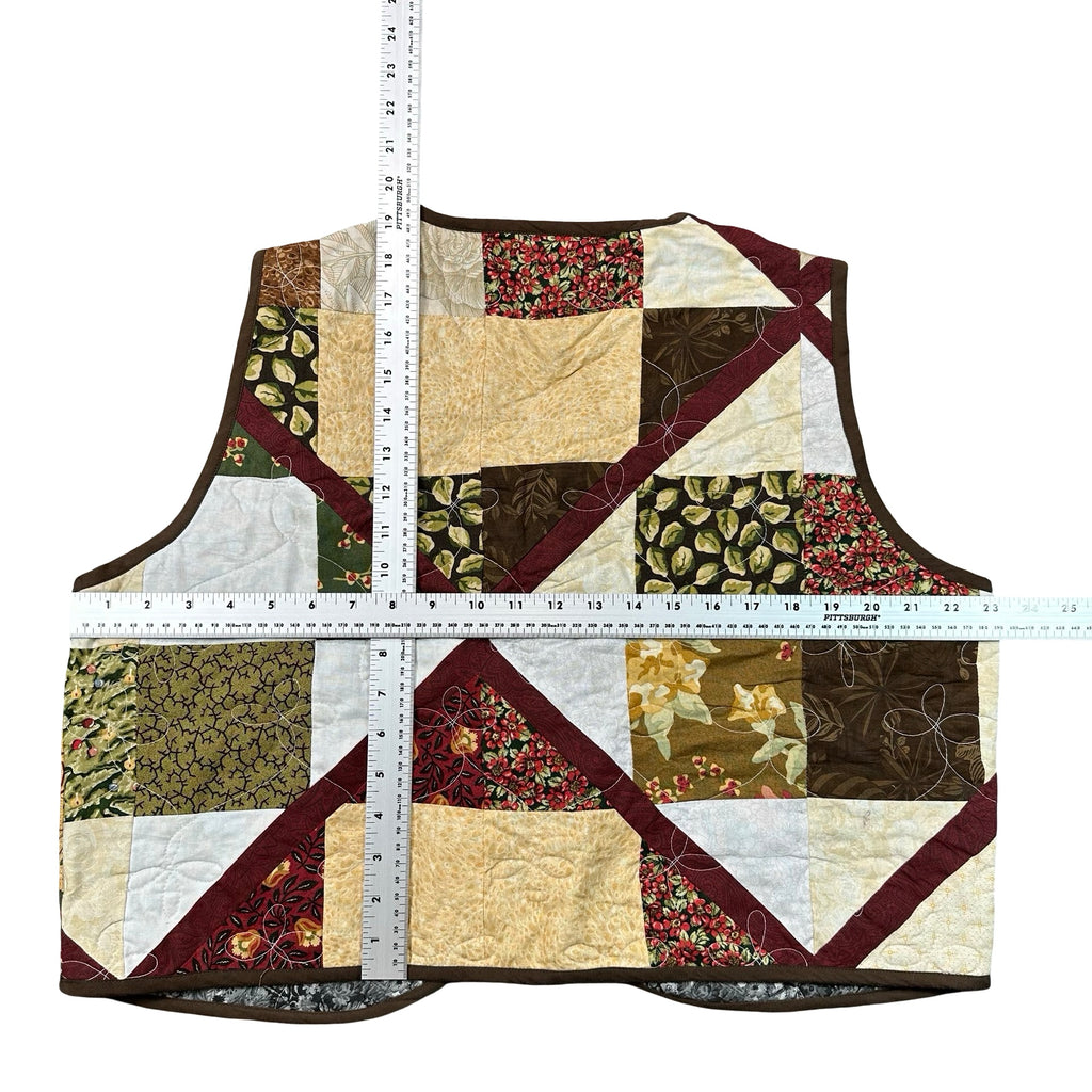 Autumn Earth Patchwork XL quilted vest rework, tape measure across the chest