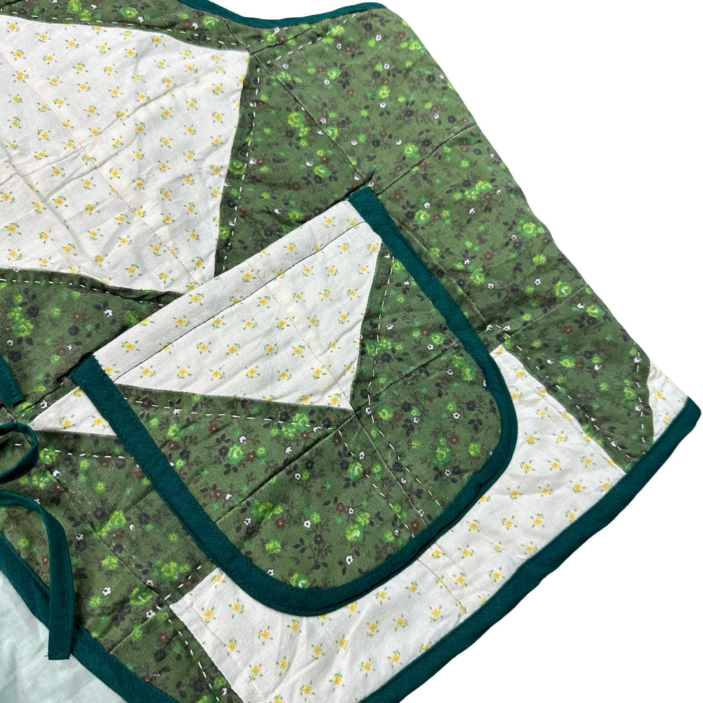 Clover Churn Dash quilted vest rework, front pocket and green calico detail
