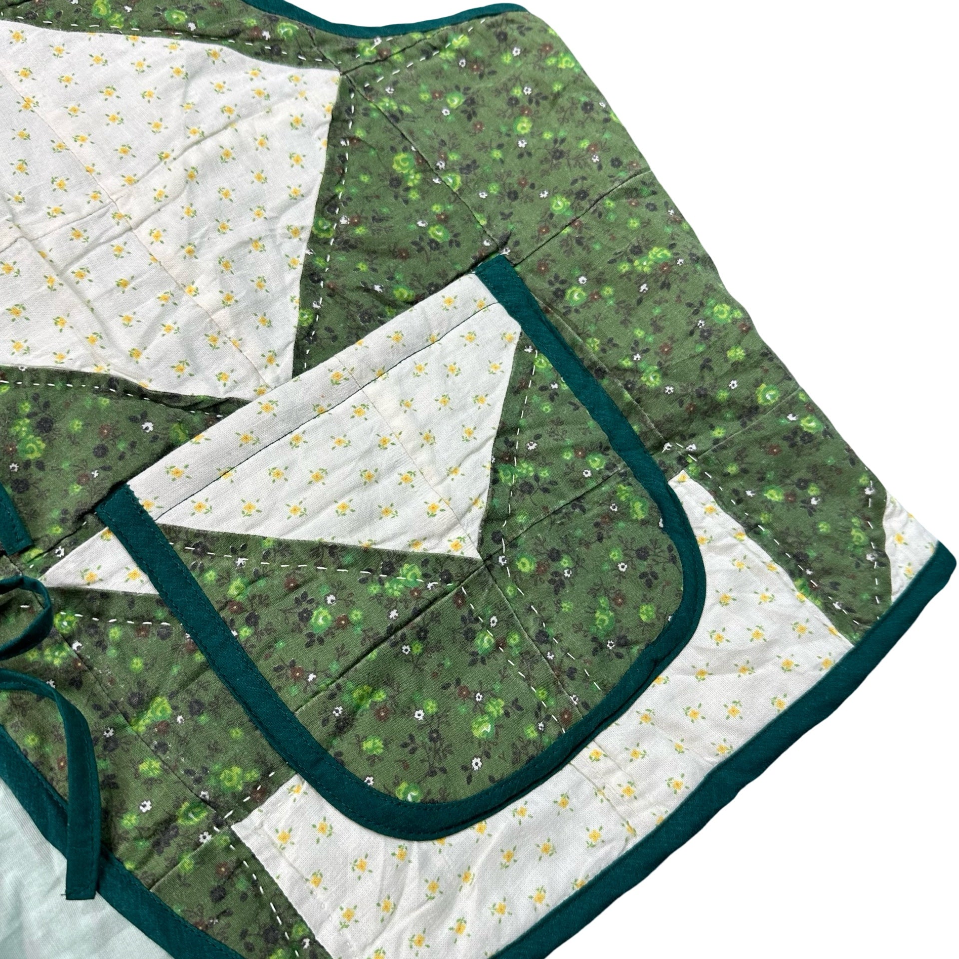 Clover Churn Dash quilted vest rework, front pocket and green calico detail