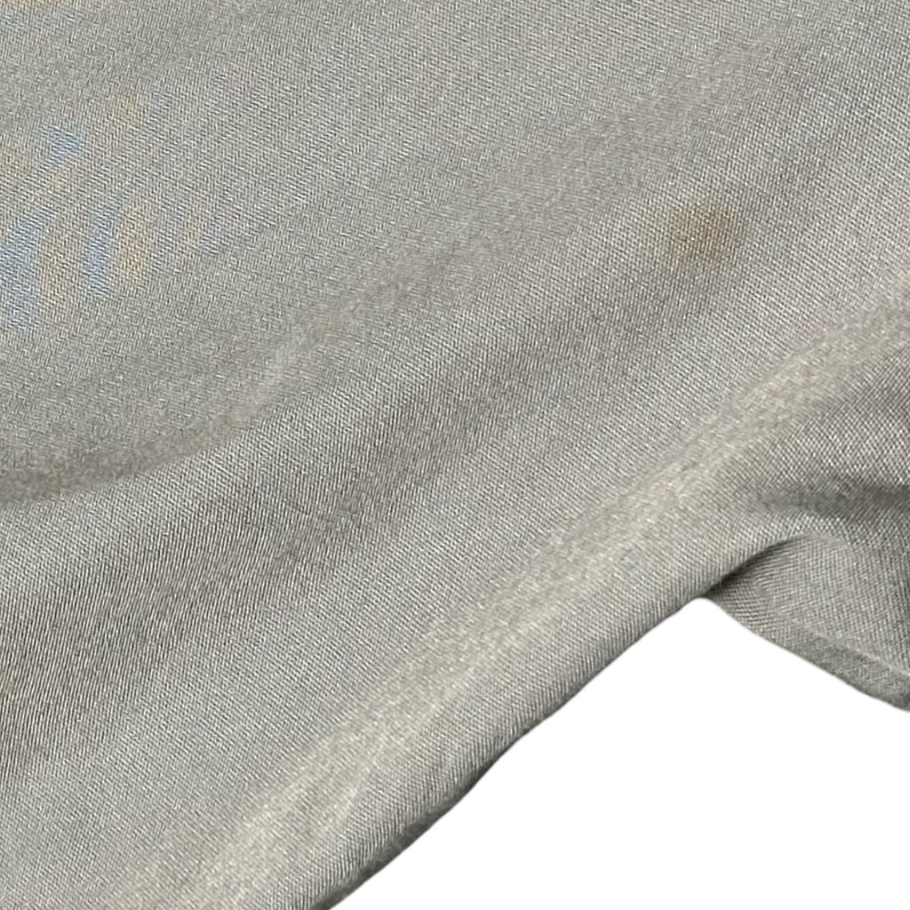 Small light stain on front - flaw