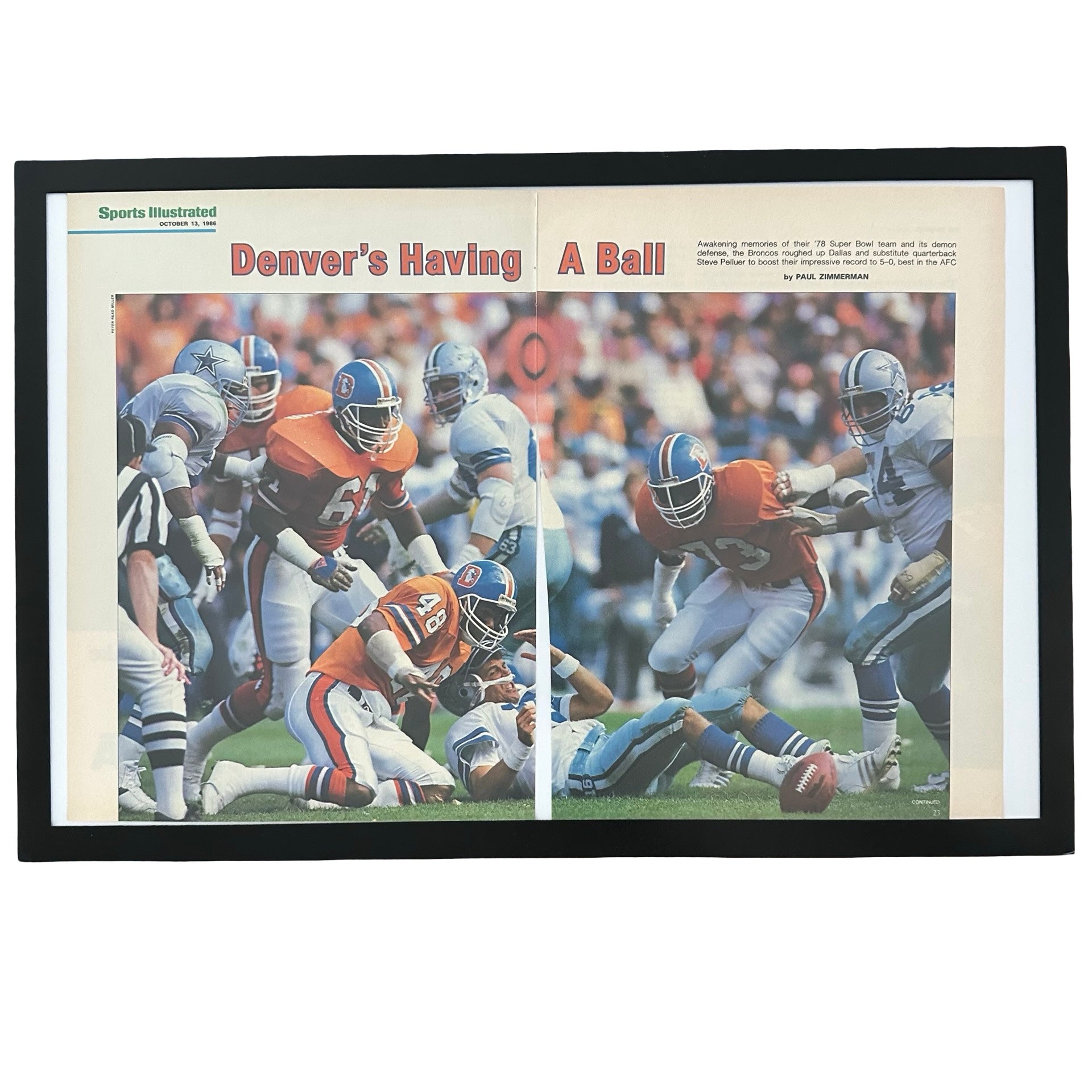 Framed vintage Sports Illustrated Denver Broncos vs Cowboys double page article on white background