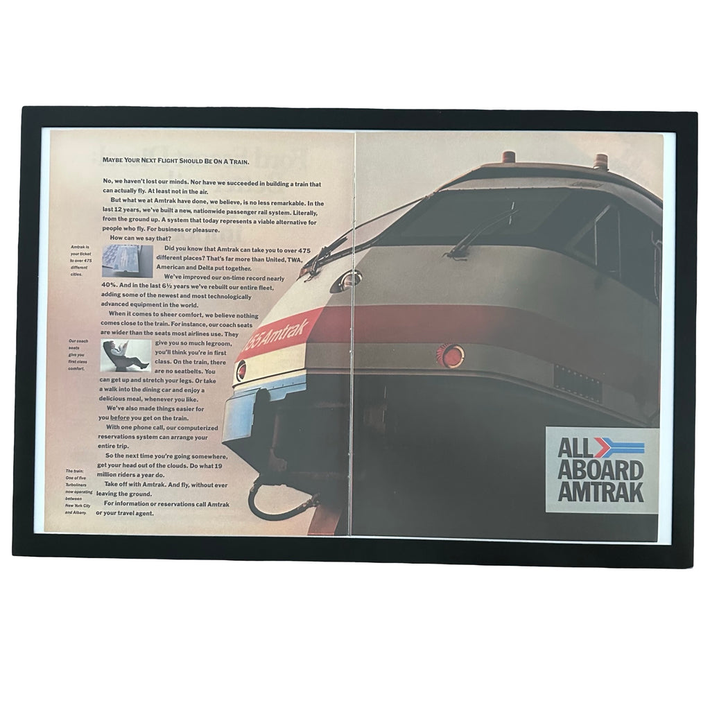 Framed vintage Amtrak All Aboard double page magazine ad on white background