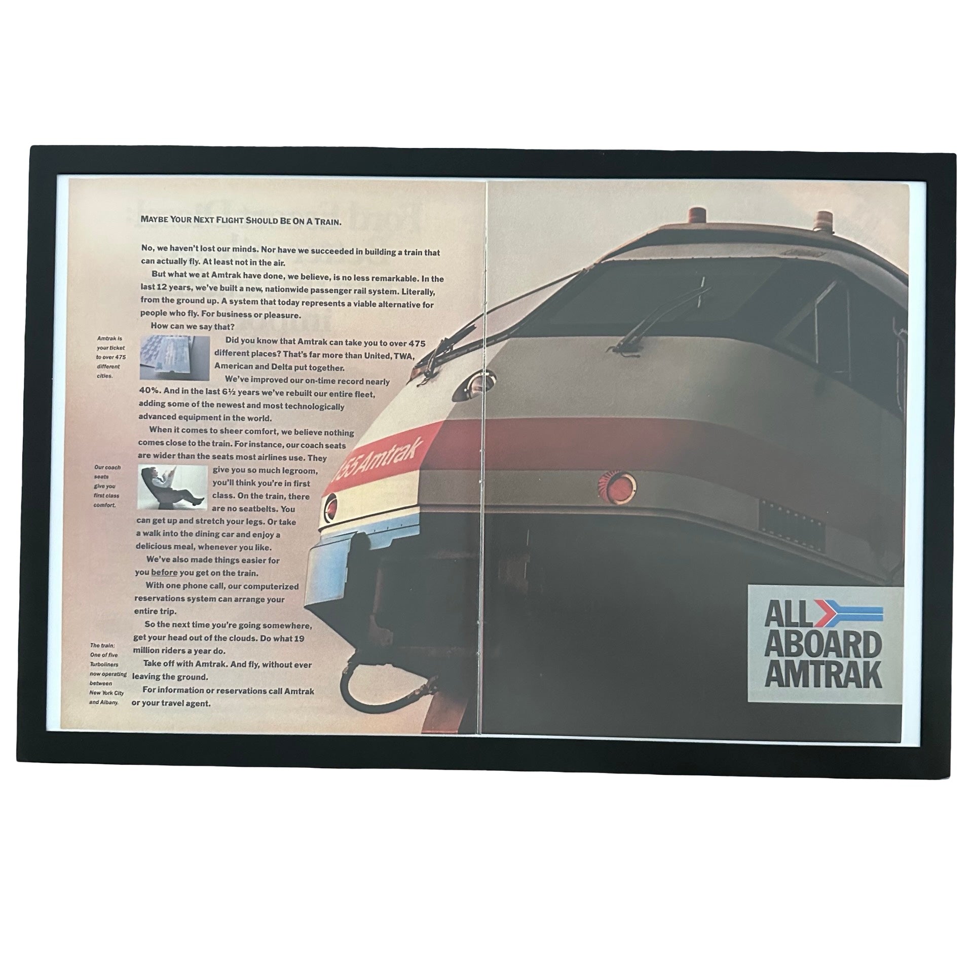 Framed vintage Amtrak All Aboard double page magazine ad on white background