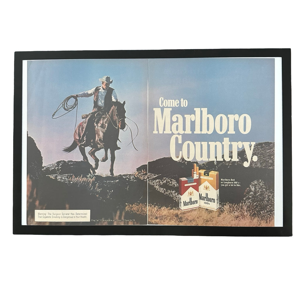 Framed vintage Marlboro Country cowboy double page magazine ad on white background