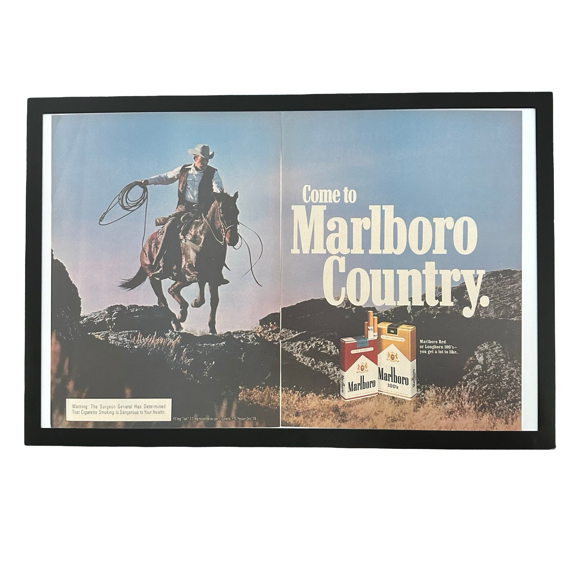 Framed vintage Marlboro Country cowboy double page magazine ad on white background