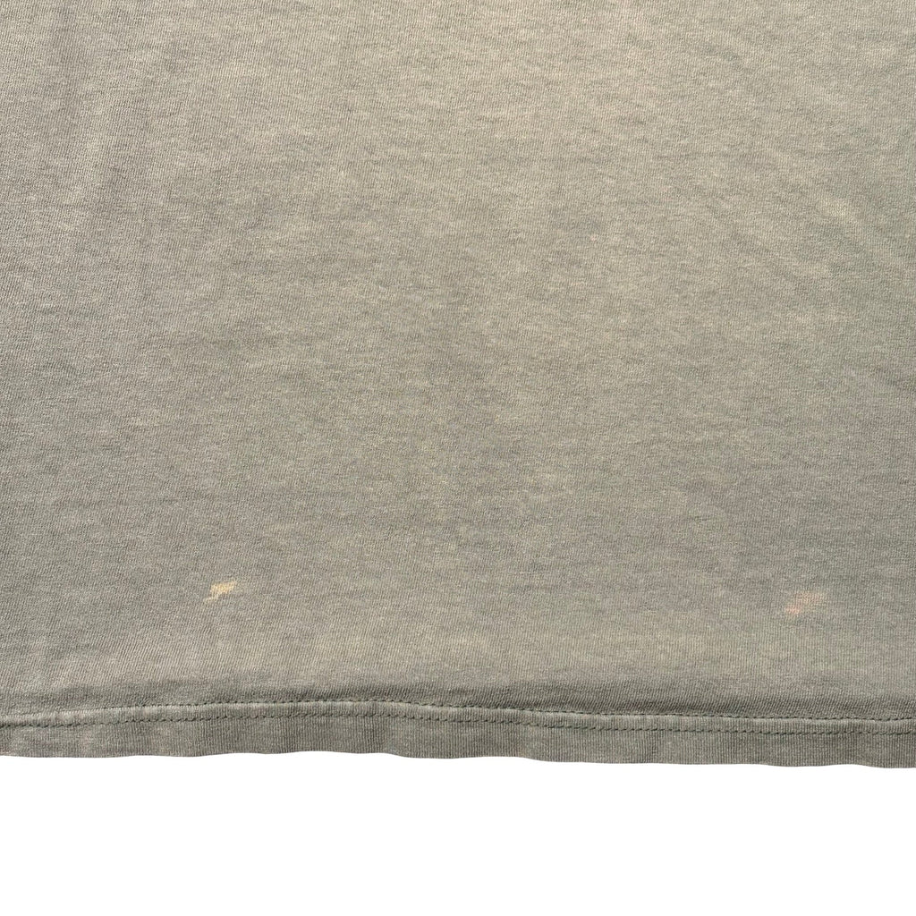 Small light marks near front hem - flaw