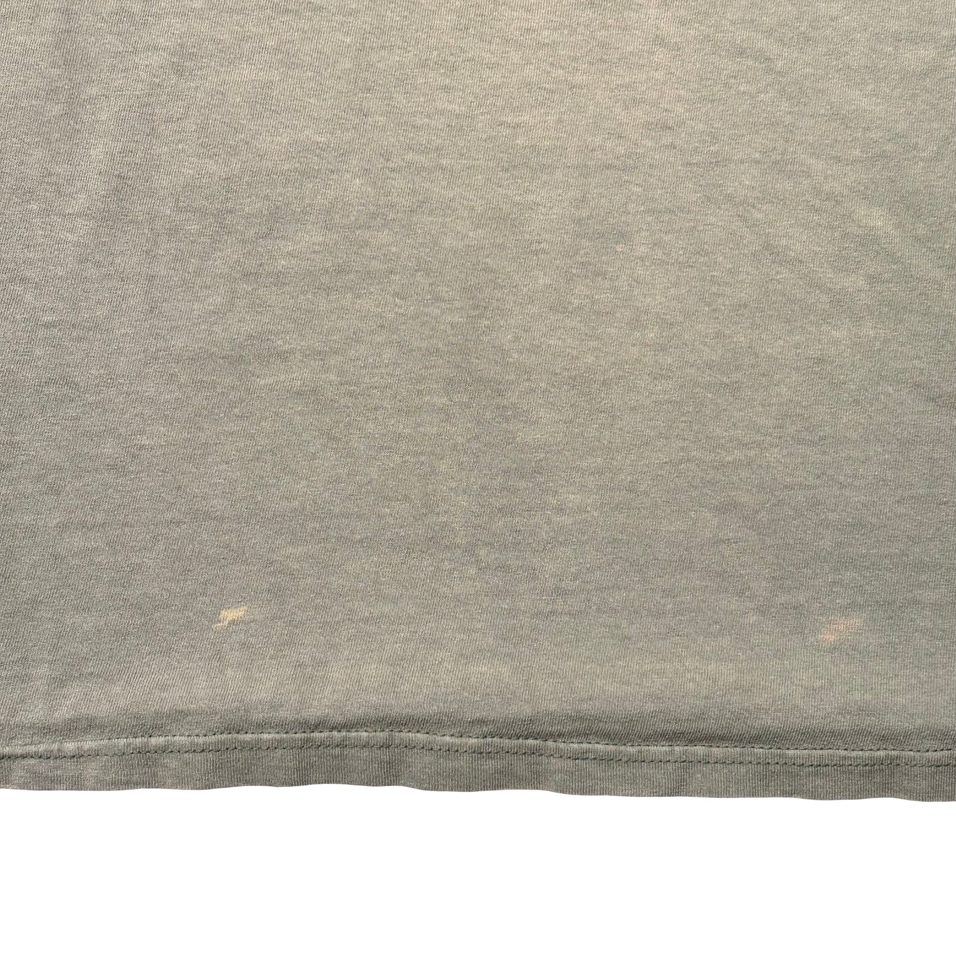 Small light marks near front hem - flaw