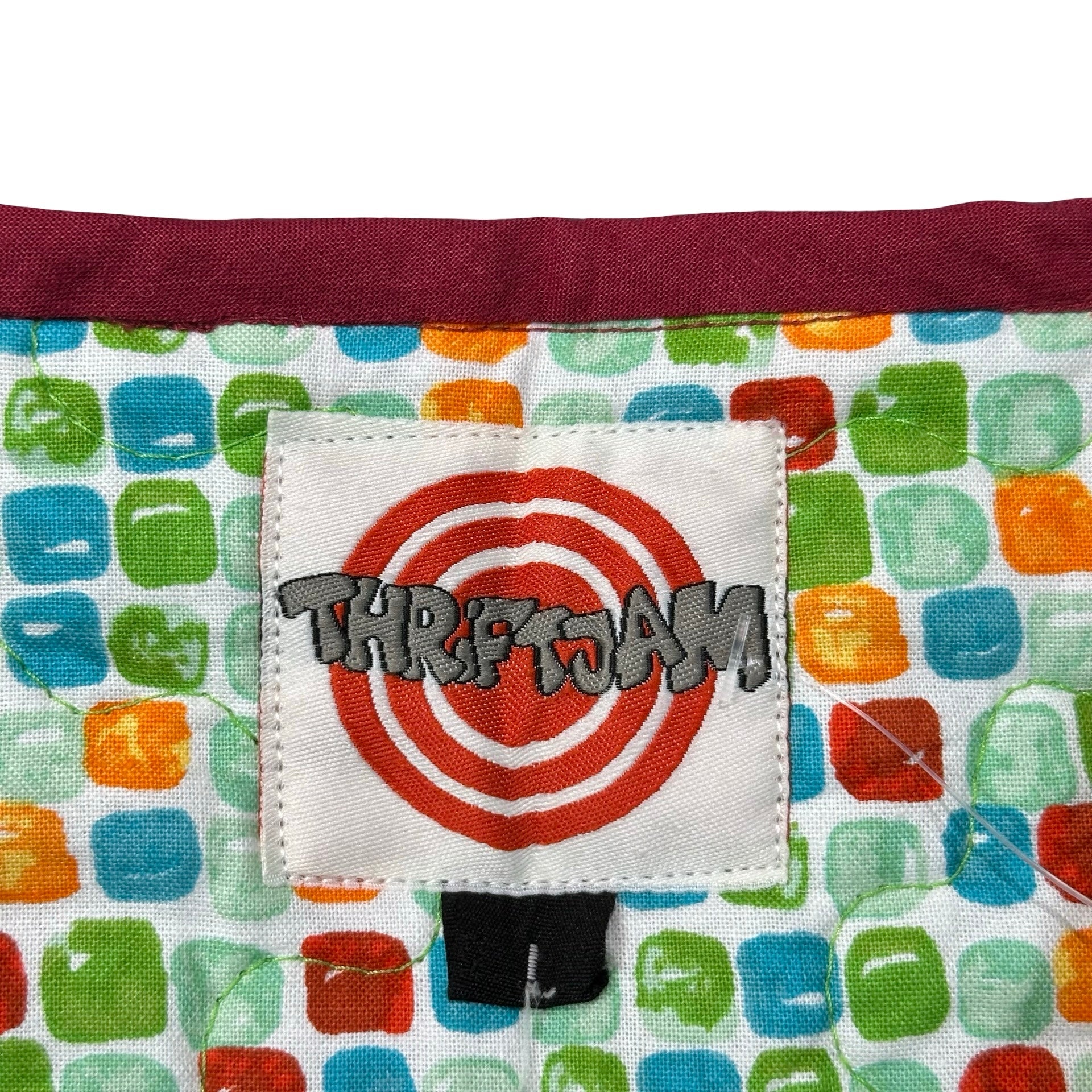 Tricycle Playroom L quilted vest rework - ThriftJam size tag