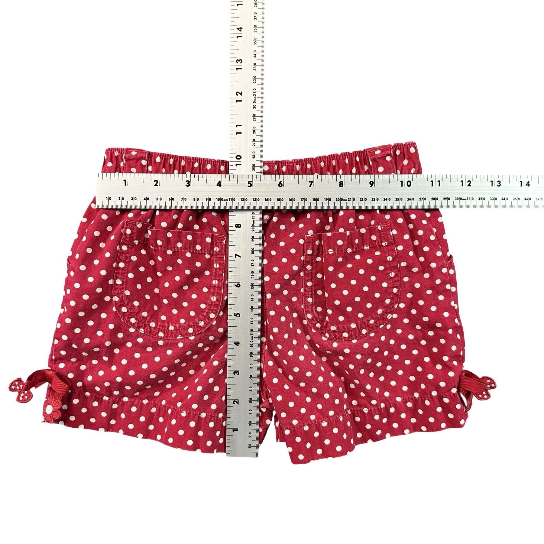 Gymboree Red Polka Dot Bow Trim Shorts Girls Size 7 - flat lay measurements with tape measure