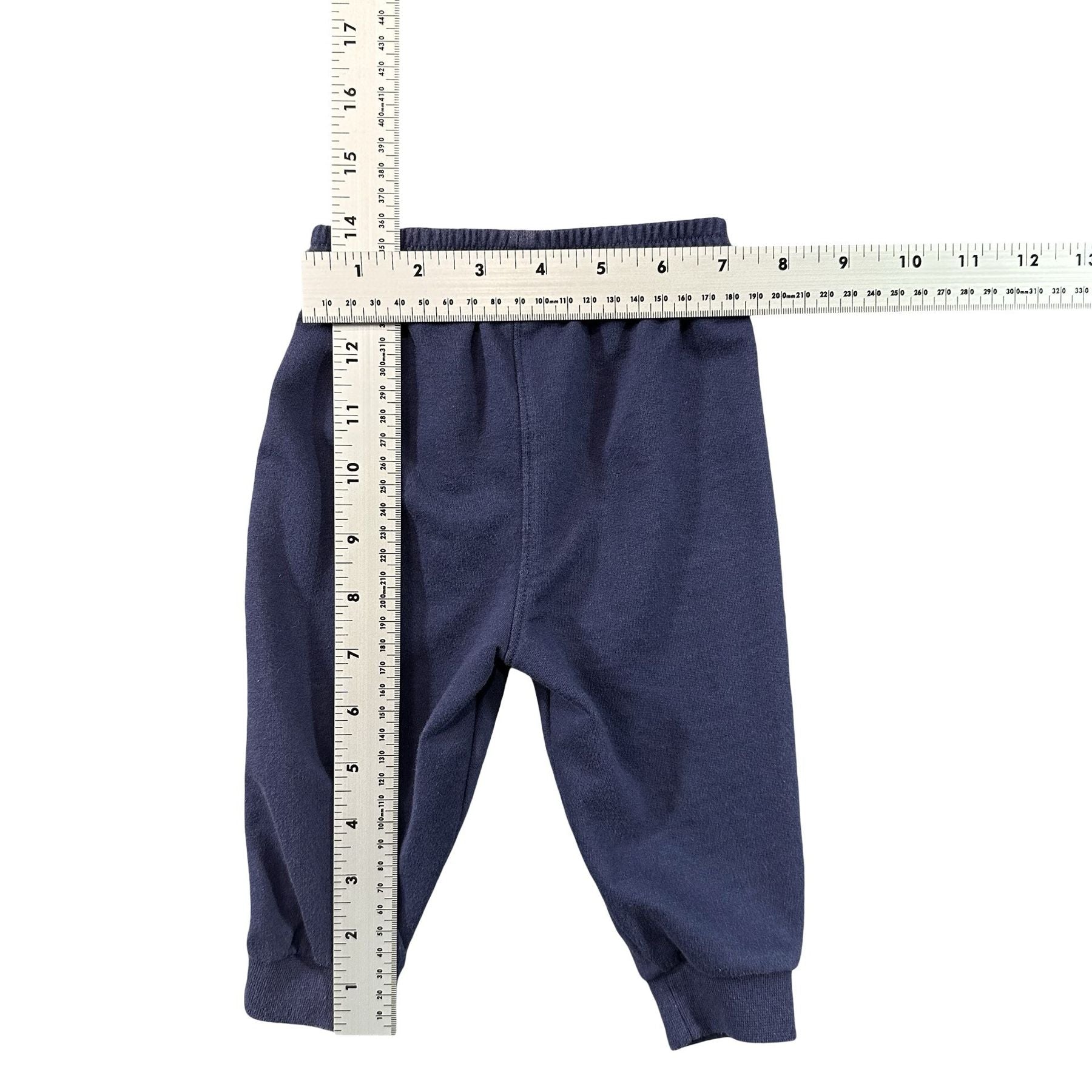 Nike Navy Swoosh Baby Joggers 9M - flat lay measurements with tape measure