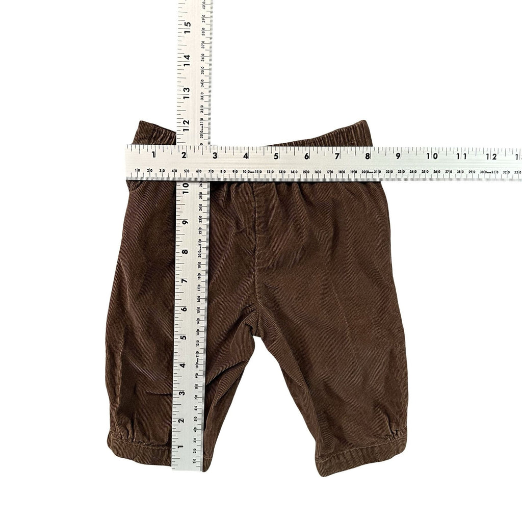Carter's Brown Corduroy Baby Pants 3M - flat lay measurements with tape measure