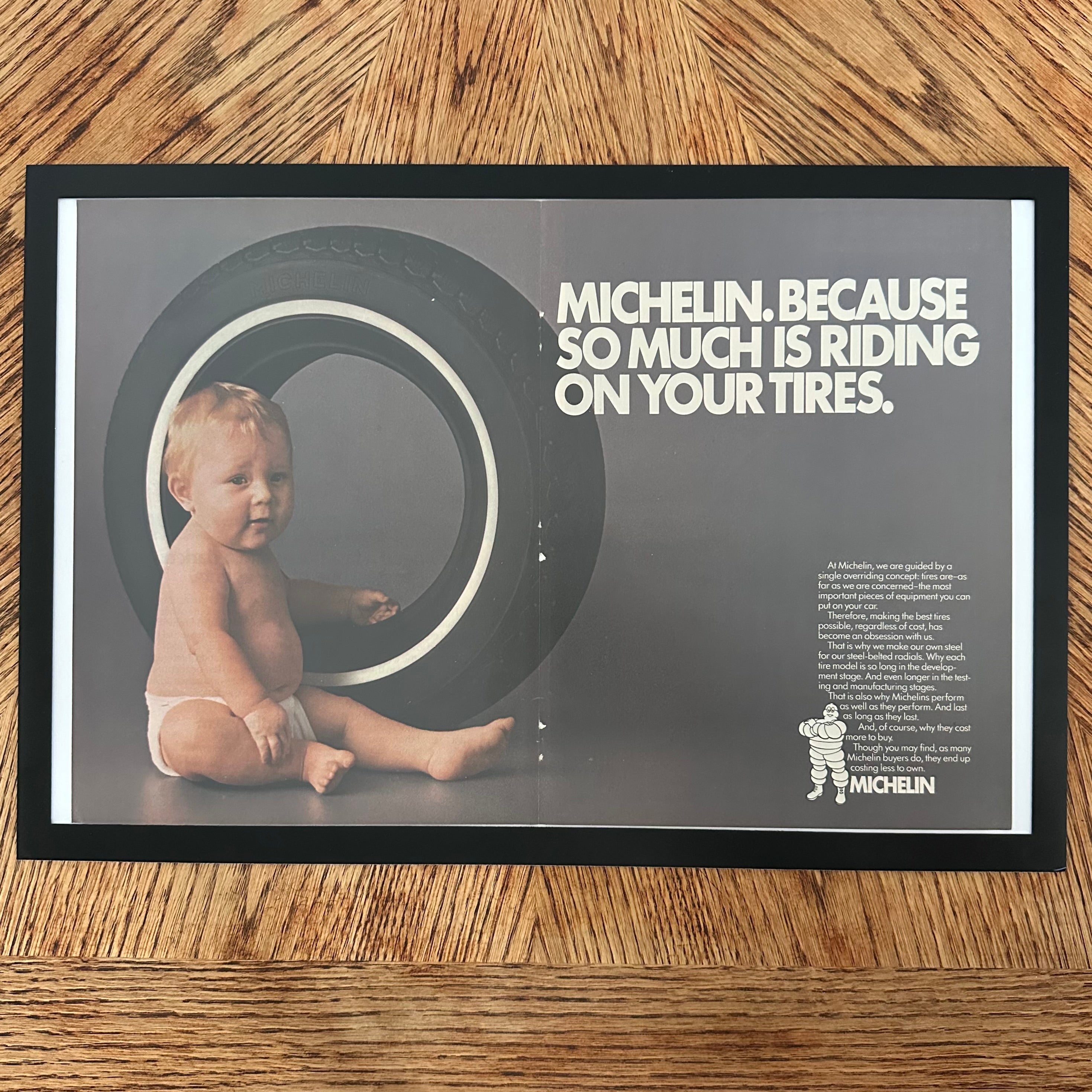 Framed vintage Michelin baby in tire double page magazine ad