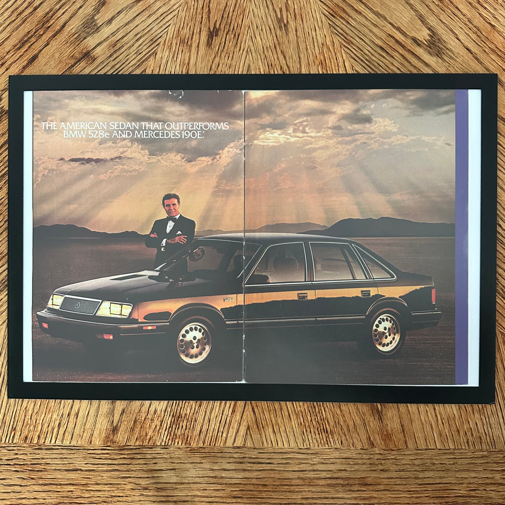 Framed vintage Chrysler LeBaron double page magazine ad with Ricardo Montalban