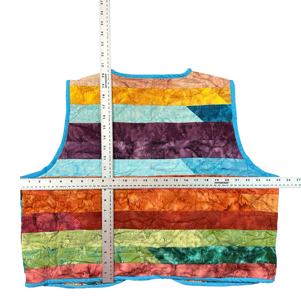 Rainbow Batik Stripe quilted vest rework, flat lay measurements with tape measure