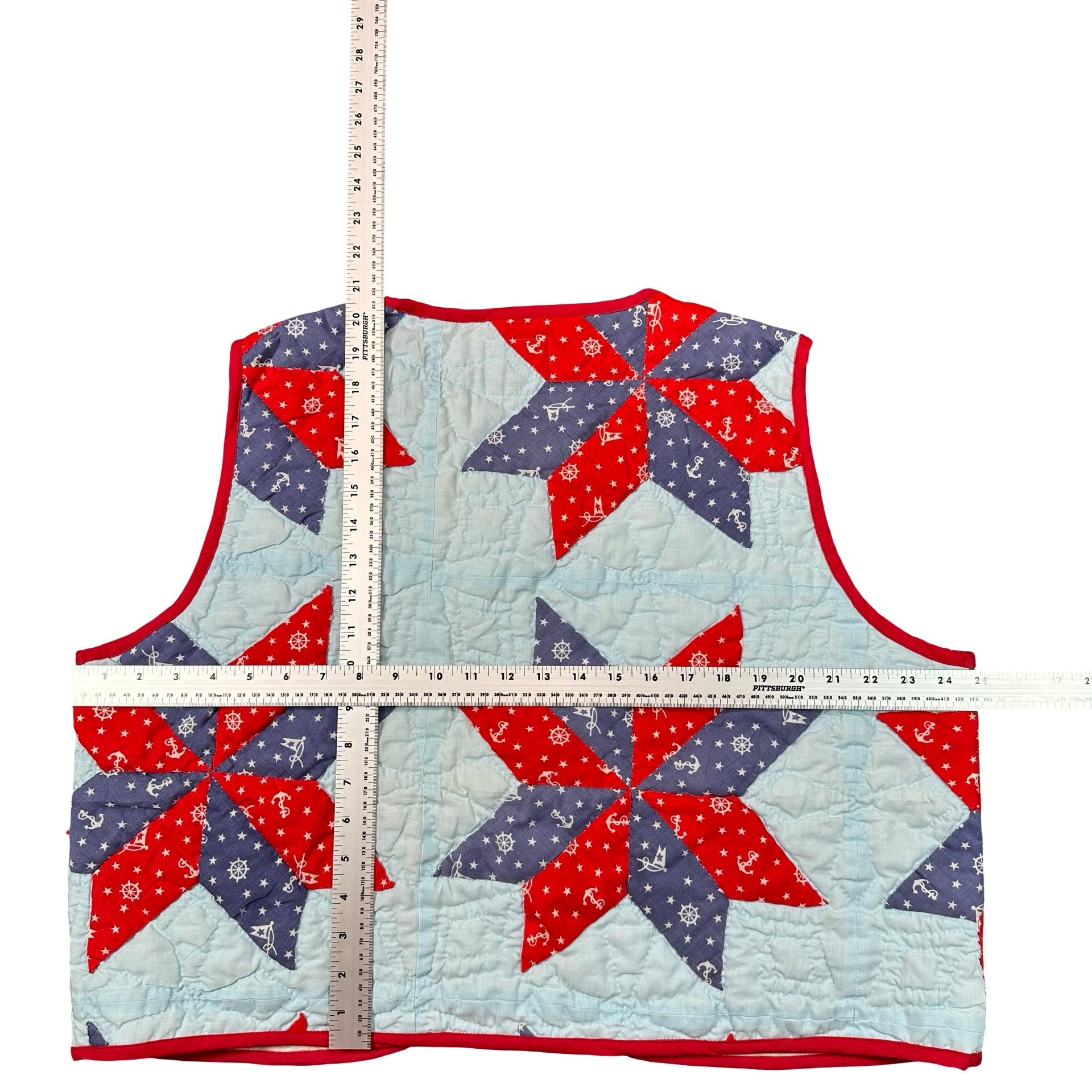 Nautical Star quilted vest rework, flat lay measurements with tape measure