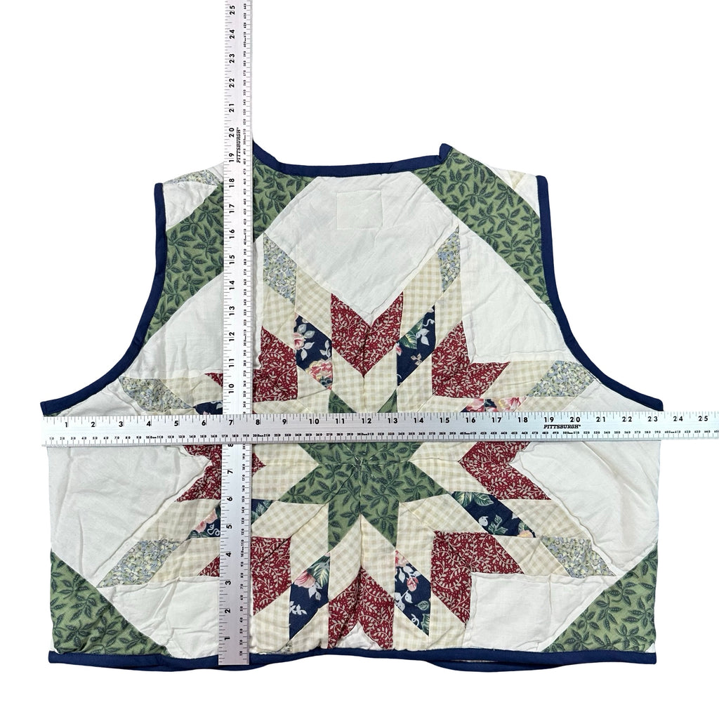 Evergreen Star XL quilted vest rework, tape measure across the chest