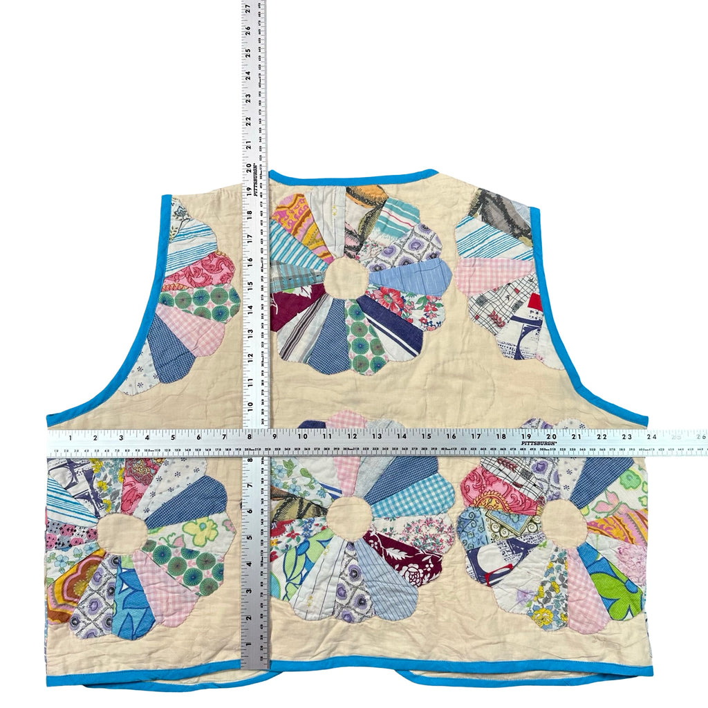 Dresden Fan XL quilted vest rework, tape measure across the chest