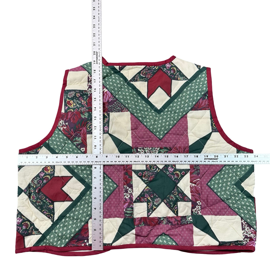Holly Berry Star XL quilted vest rework, tape measure across the chest