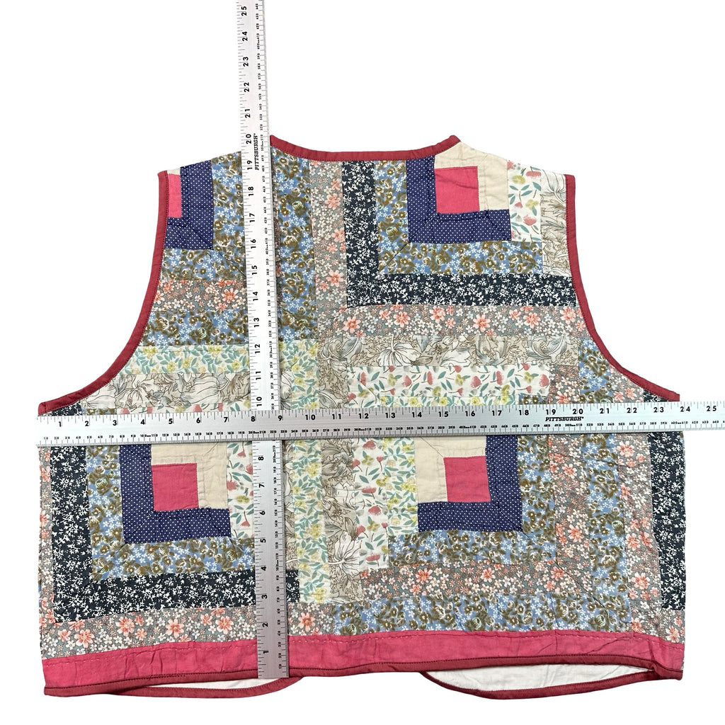 Rosebud Log Cabin XL quilted vest rework, tape measure across the chest