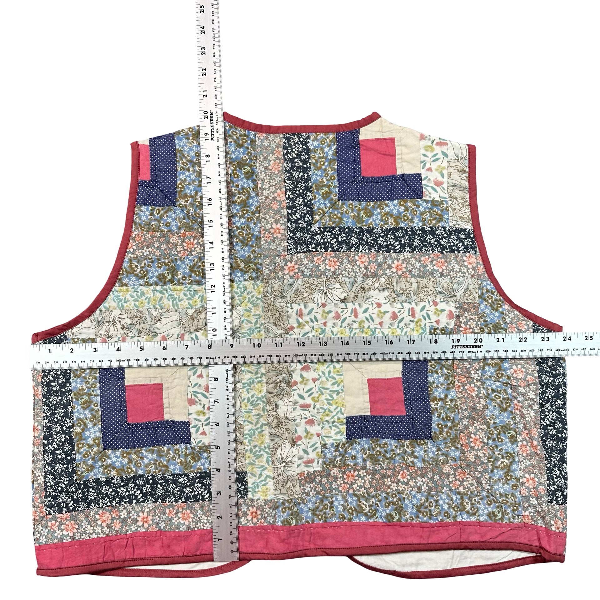 Rosebud Log Cabin XL quilted vest rework, tape measure across the chest