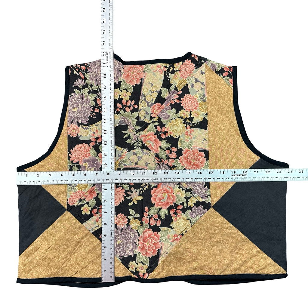 Midnight Cabbage Rose XL quilted vest rework, tape measure across the chest