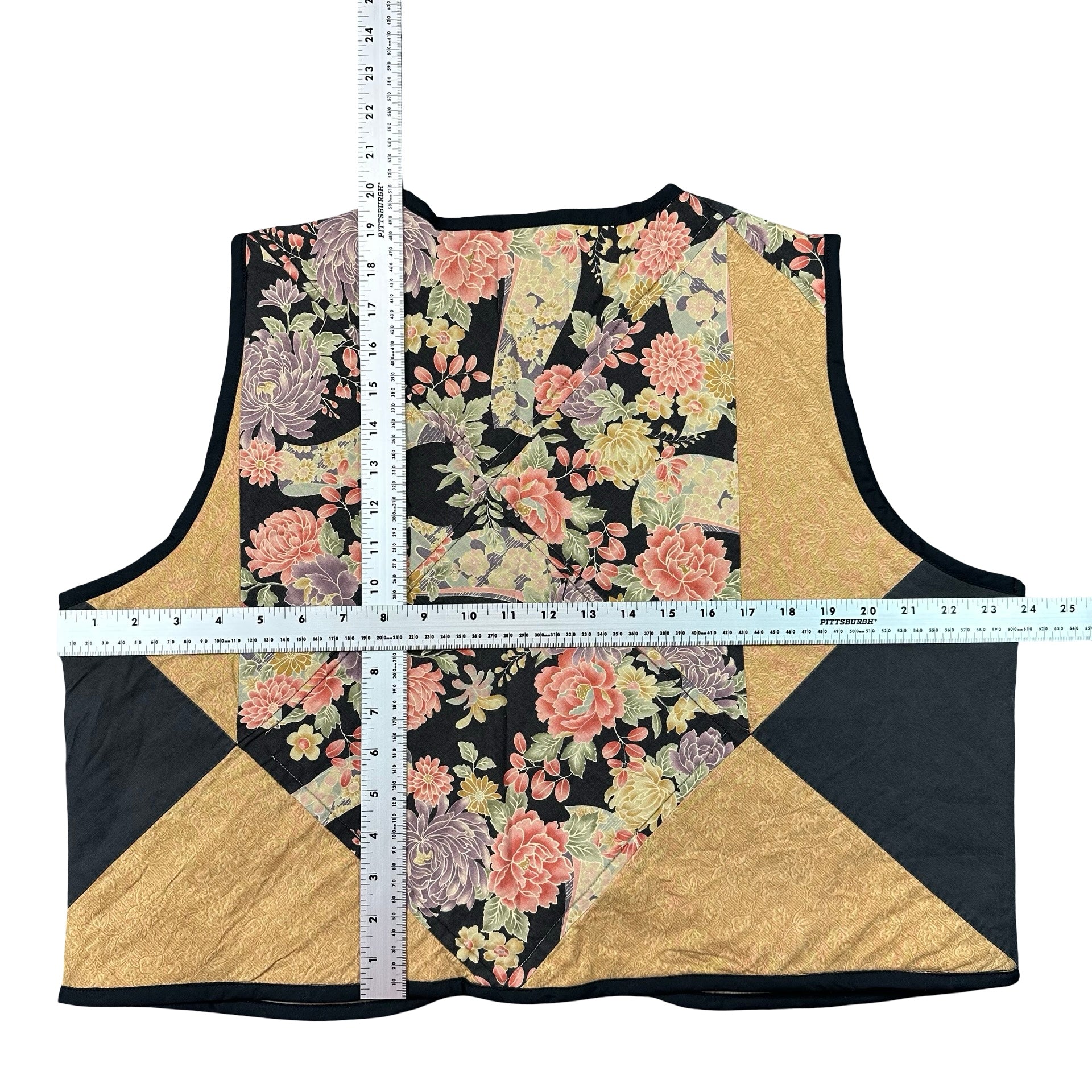 Midnight Cabbage Rose XL quilted vest rework, tape measure across the chest