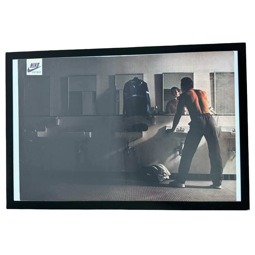 Framed vintage Nike Sportswear locker room double page magazine ad on white background