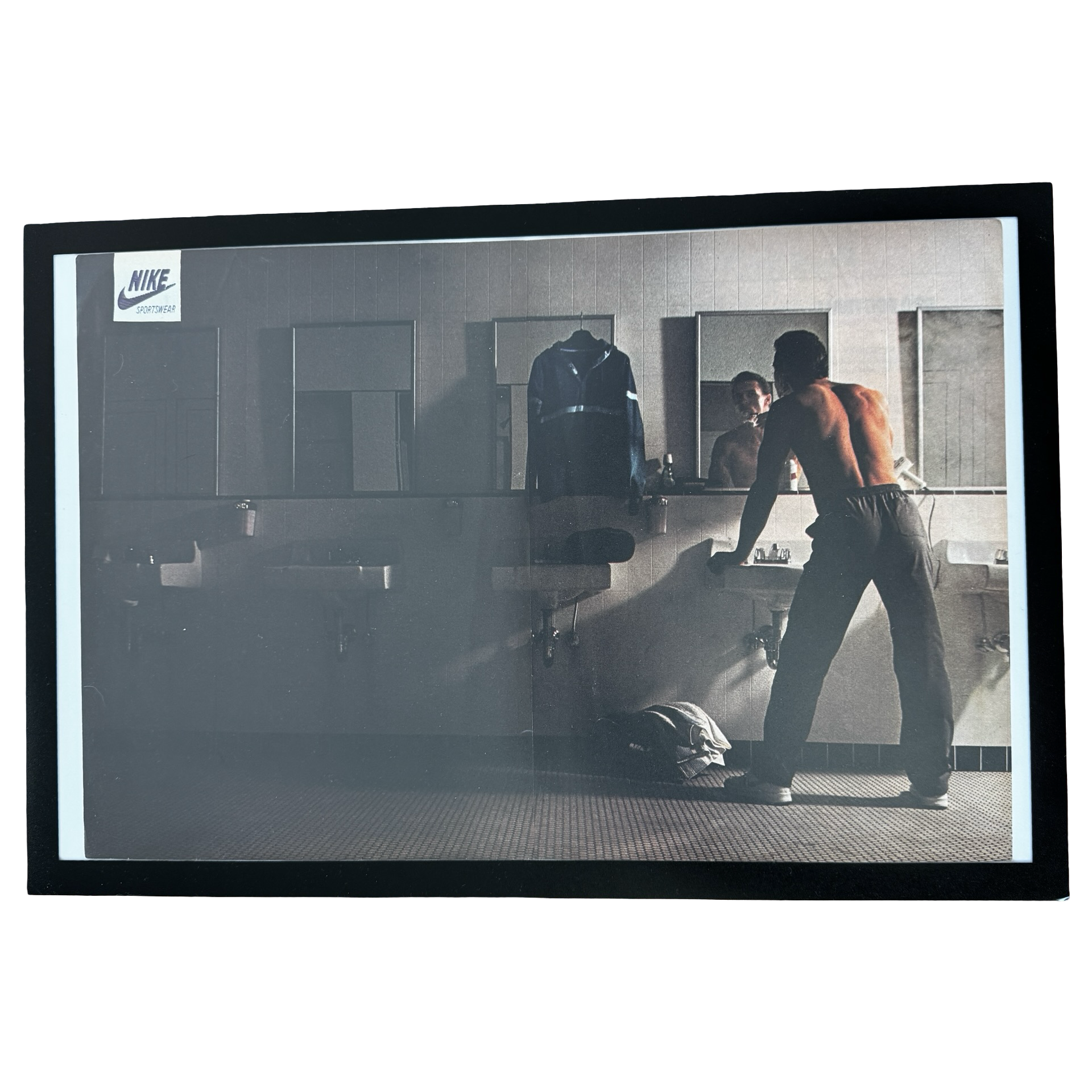 Framed vintage Nike Sportswear locker room double page magazine ad on white background