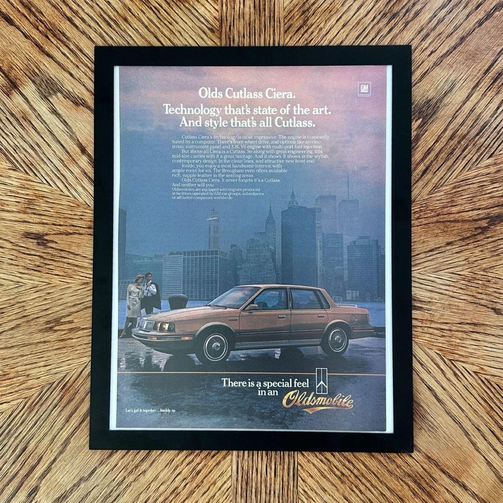 1980's Oldsmobile Cutlass Ciera NYC Skyline Vintage Car Magazine Ad with Frame