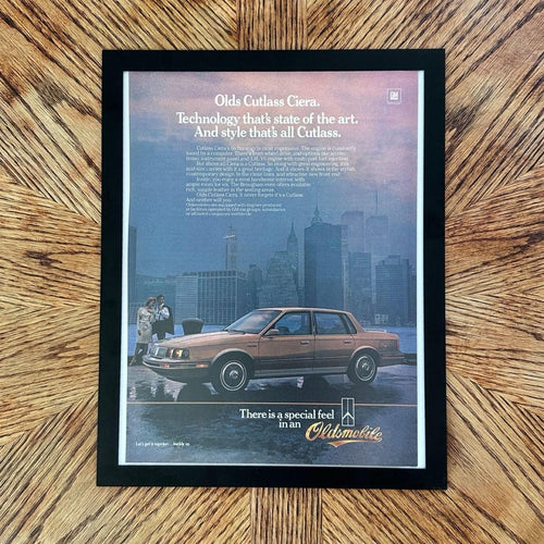 1980's Oldsmobile Cutlass Ciera NYC Skyline Vintage Car Magazine Ad with Frame