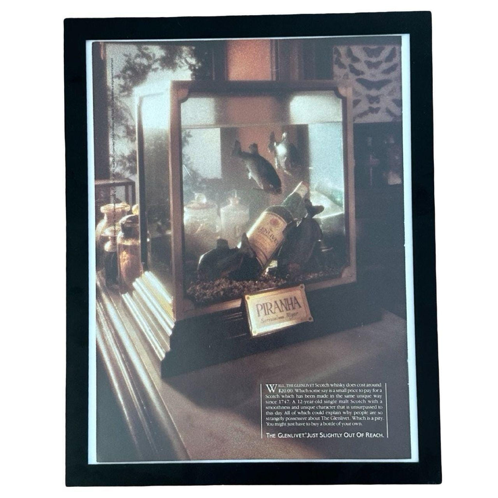 1986 Vintage "The Glenlivet Just Slightly Out of Reach" Piranha Scotch Ad with Frame