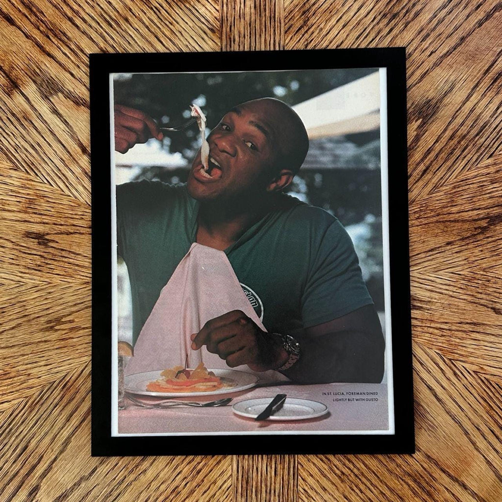 George Foreman Dining in St Lucia Sports Illustrated Editorial Photo