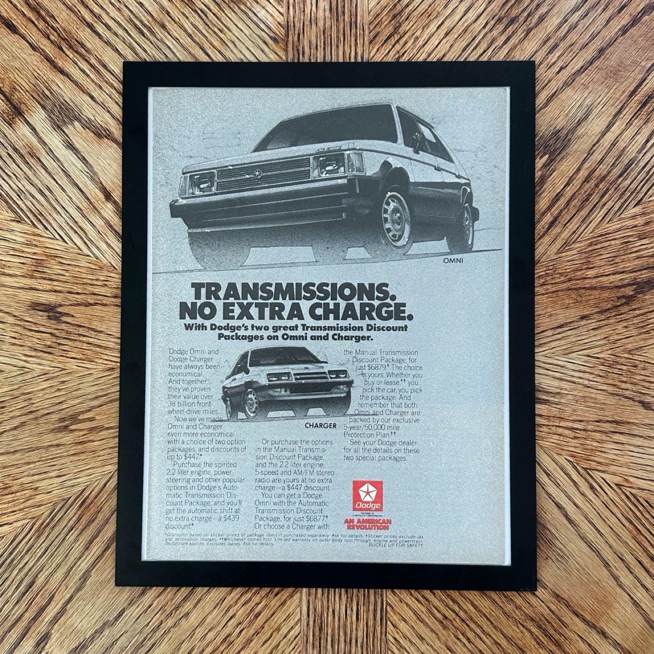 1980's Dodge Omni and Charger "Transmissions. No Extra Charge" Vintage Magazine Ad with Frame